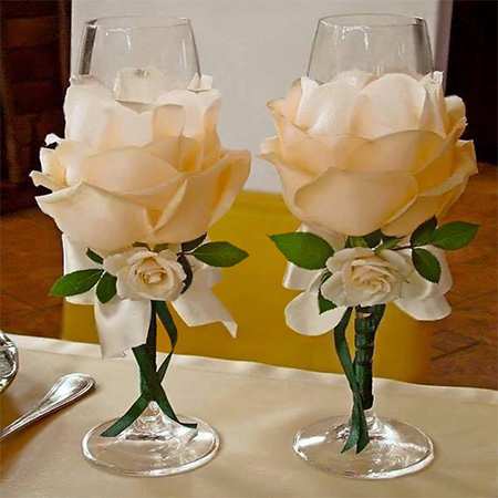 There are some really stunning silk flowers that you can buy, and we show you how to use silk flowers to dress up champagne glasses for a special occasion.