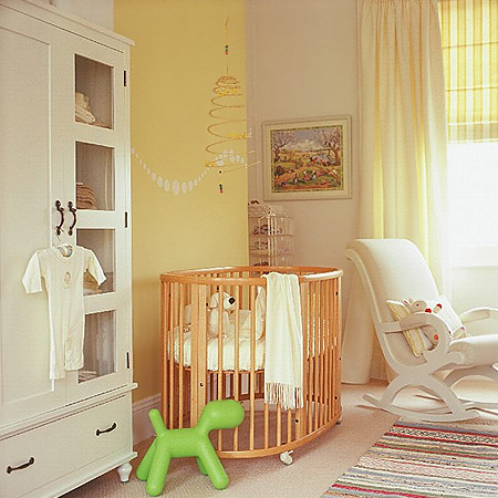 In a small nursery where you want to introduce wood furniture, look for pieces that are made of light coloured timber, as these won't make the room feel cramped and dark
