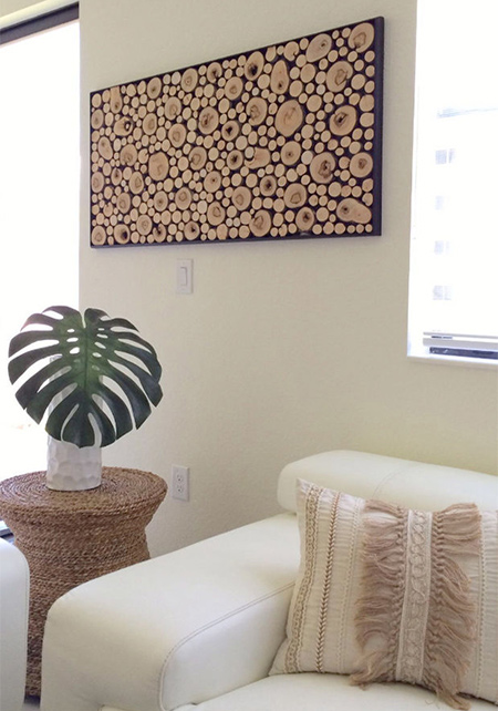 Use trimmed branches to make this unique, framed wood art for a feature wall.