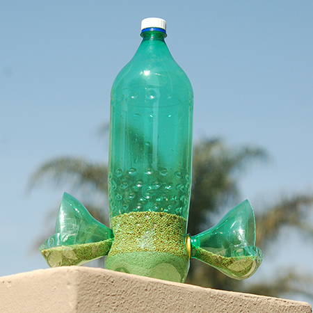 I like to recycle plastic as much as possible, and love this idea for using plastic cold drink bottles to make a bird feeder for the local bird life.