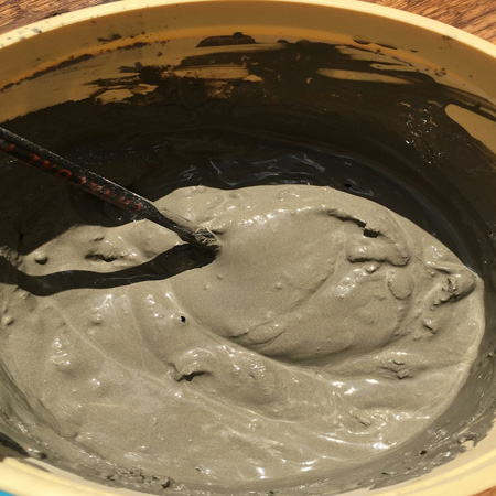 Mix the cement into a smooth consistency - it shouldn't be too runny or too stodgy. Aim for a porridge or thick cream consistency