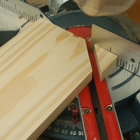 3. Use a mitre saw - or jigsaw -  to cut 45-degree corners off the handle.