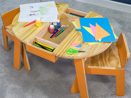 This child-sized play and craft table will inspire creativity. Featuring work and storage space and chairs that are just the right size. Use a ready-made top and ad a few angles and gentle curves for style. 