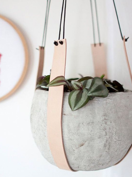 If you don't consider yourself very handy but like the look of macrame hangers, look at materials that can be used as an alternative so that you don't have to do any knots, like a  leather plant hanger