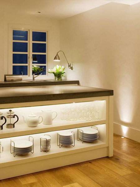 LED strip lights offer an inexpensive way to add lighting design to a kitchen and can be mounted discretely above cabinets or to light cabinet countertops.