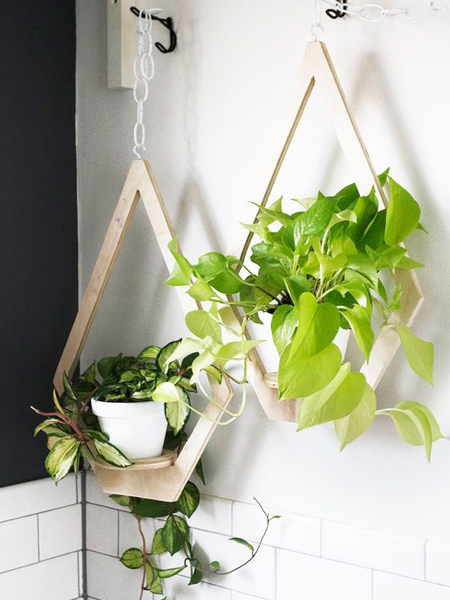 For those with the necessary tools and some basic DIY savvy, there are a variety of wood products that you can use to craft unique plant hangers. Love the plywood plant hangers shown - and so easy to make. 