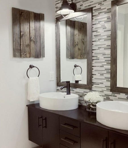 Ditch the melamine countertop and fit a floating bathroom vanity with a 'his' and 'hers' basin. Bring in complementary accessories that finish off the look. Framed mirrors are easy to make and can be stained or painted to match the decor.