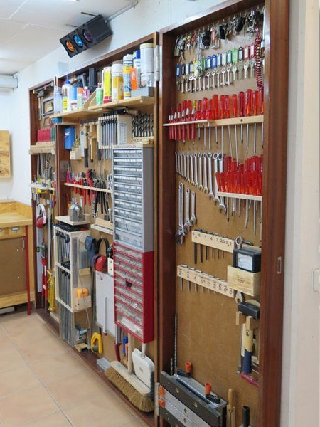 If you prefer to keep your tools and bits and bobs out of sight, it's easy to knock up a small wall cabinet with doors that can be fully opening for when you need access to tools and such. 