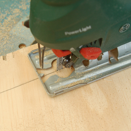 Use a fine-toothed blade to cut the plywood and reduce ripping. I used a jigsaw blade for steel to cut the plywood.