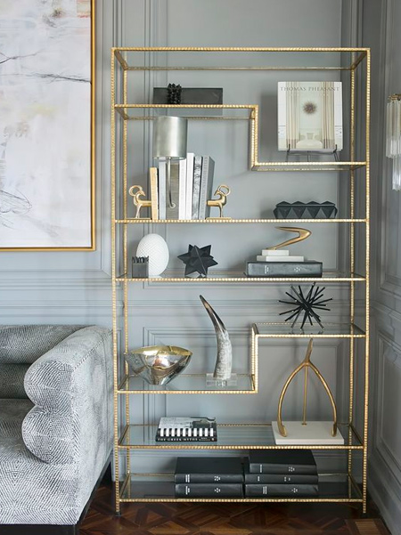 Use Rust-Oleum metallic spray paint to finish off a welded steel display cabinet. The warmth of gold instantly heats up a grey colour scheme. 