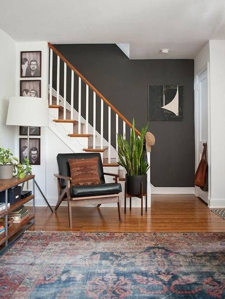 Not quite black - a charcoal wall provides the perfect canvas for light walls and dark accent pieces.