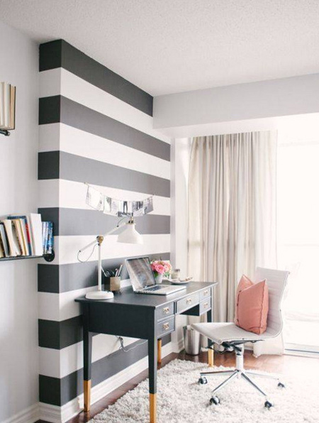 Even a small dose of black can go a long way. Black and white stripes provide a high-contrast, modern vibe when paired with traditional furniture.