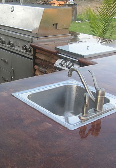 HOME-DZINE | Outdoor Kitchens - Take into consideration that, if you are adding elements that require electrical points or lighting and plumbing for water, the kitchen will need to be located close to existing supply lines for these services, especially if you want to keep the costs of building an outdoor kitchen as low as possible.