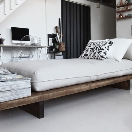 HOME-DZINE | DIY Furniture Ideas - The design for the Day Bed is super simple: long wooden planks are mounted on simple plank legs of horizontal planks to provide support for the comfortable ready-made futon that serves as seating and a guest bed when needed.