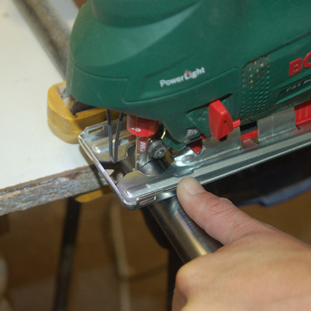 HOME-DZINE | Upholstery Projects - Clamp the pipe to your work bench and use a jigsaw and steel jigsaw blade to cut a length of pipe - 120 to 150mm should be sufficient. 