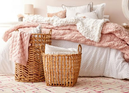 Contain clutter in a bedroom with attractive storage. Baskets are a versatile alternative to bulky furniture for the smaller bedroom, and you can place them wherever they're needed. 