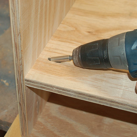 4. Measure 130mm from the top and mark. Use this as a guide for mounting the top shelf. Secure to the sides with pocket-hole screws.