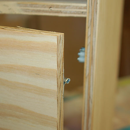 11. Secure the individual components to the door and cabinet frame.