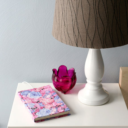 HOME-DZINE | Craft Projects - Transform a notebook into a pretty cellphone holder to hold your cellphone while charging. Cover the book with wrapping paper or fabric that complements the decor in your bedroom. You can use any notebook for this project, as long as it is large enough to accommodate your cellphone. 