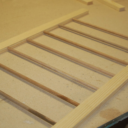 add dowels to laundry drying rack