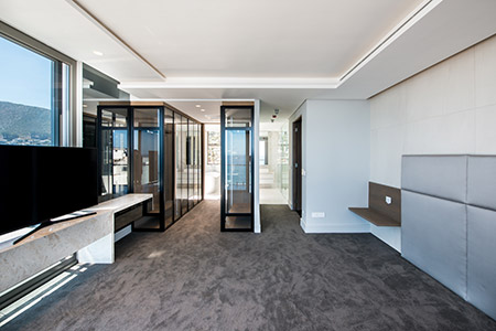 Fairmont Penthouse - To illuminate the space, modern architectural lighting in steel boxes was combined with pedant fixtures and recessed LED lighting in ceiling troughs. LED lighting has also been placed throughout the joinery.