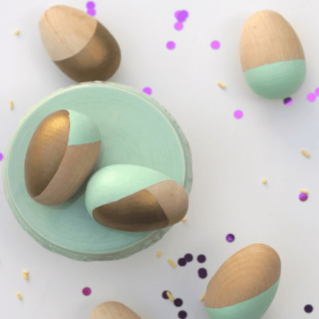 Give wooden eggs a geometric look with two or three different paint colours that complement your table setting. Use masking tape to mask off the areas to be painted.