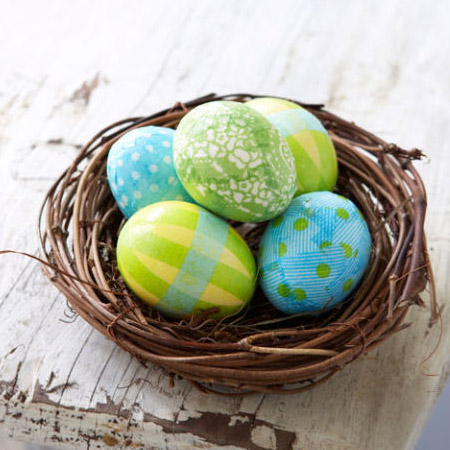 Create a colourful basket of Easter eggs by wrapping them in tissue paper. Layer on scraps of tissue paper with ModPodge and then coat with extra ModPodge to finish.
