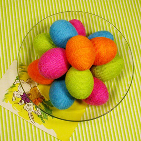 Got some yarn left over? Apply craft glue and wrap the eggs with colourful yarn.