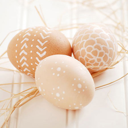 Go for a natural touch for this year's Easter eggs. Plain brown eggs are painted with unusual designs with a white paint pen.