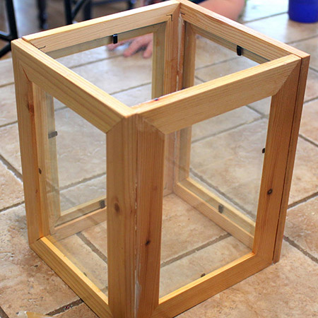 This is a cheap and easy way to make your own decorative lanters, as you already have the frames with the glass inside.