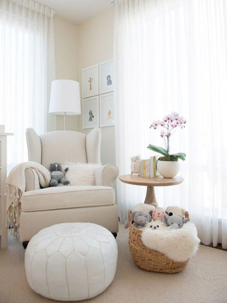 Gender neutral white nursery with wood accents rustic modern upholstered chair