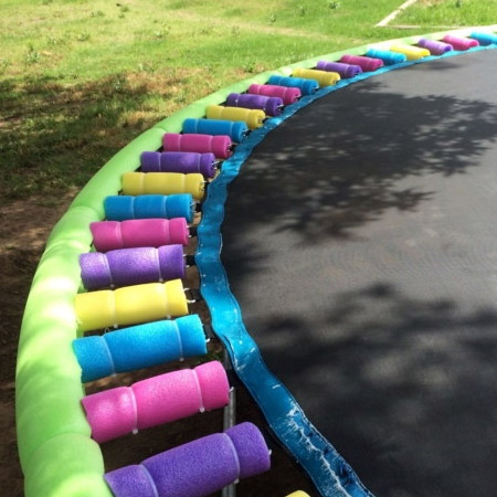 Use zip ties to secure cut sections of a pool noodle over the top of the springs