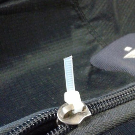 Thread a zip tie through the top of the zipper to open and close with ease