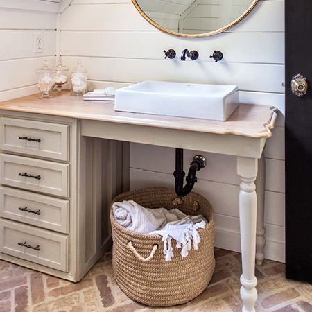 The sink vanity is one that was a secondhand find restored with paint