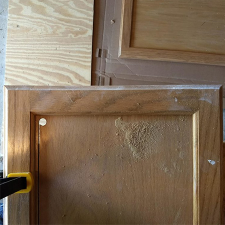drill hole in wood panel