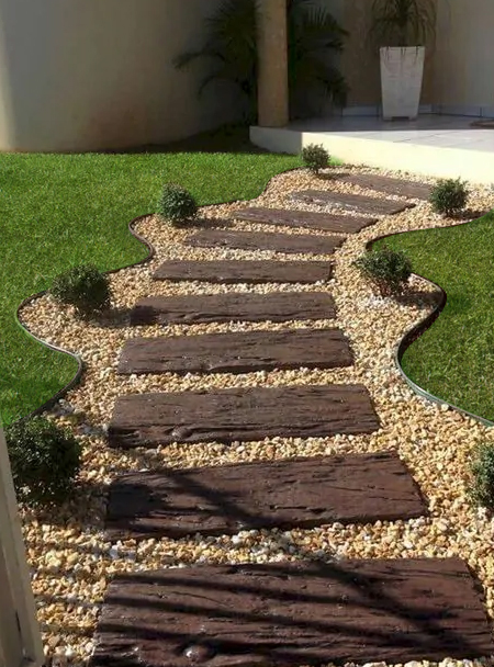 gravel and pebbles with wooden path
