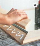 Using wood glue, press each piece firmly in place to create the frame around the mirror and leave to dry