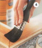 Brush wood stain in a colour to suit your room scheme over the wooden frame.