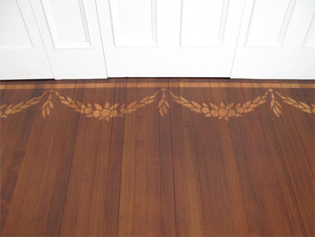 Add a painted border to wood or laminate floors 