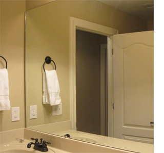 How can you add a frame to a bathroom mirror?