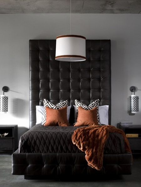 Sophisticated and glamorous, both bed and headboard are treated to soft leather upholstery with tufted design. The height of the headboard adds drama to the setting, further enhaced by patterned textiles and rich, luxurious faux fur bed throw. 