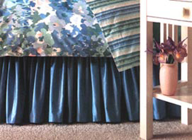 Gathered bed skirts finish off a plain bed
