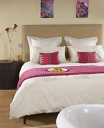 Add a splash of colour to the bedroom with accessories