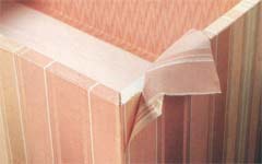 Centre over top of lid, wrapping fabric around sides to bottom, forming mitred corners