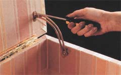 Attach hinge. Position lid support and mark screw locations, using a pencil