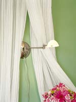 Cascades of sheer fabric that puddles to the floor and frames the bed