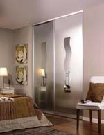 Decorative panels adorn the closet doors and add to the decor of the room