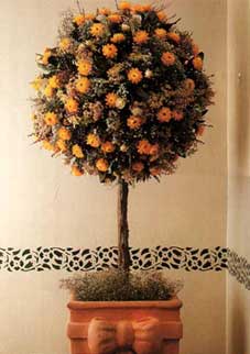 If you don't have green fingers, a topiary tree is a lovely way to bring a touch of outdoors indoors!