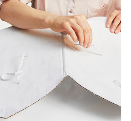 Make angel wings with feathers and trim