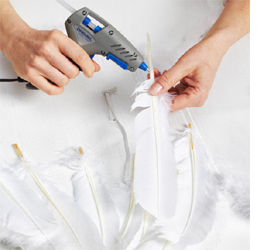 Make angel wings with feathers and trim